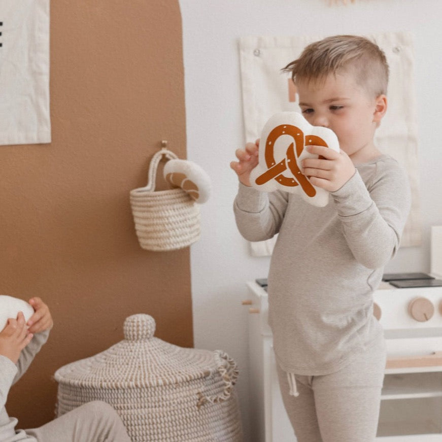 kid with bread basket pretzel